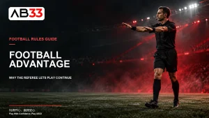 AB33 football advantage cover showing an illustrative referee extending both arms under red stadium lights.